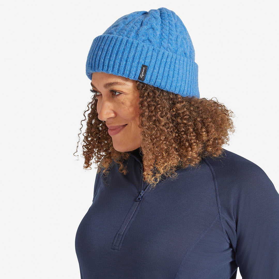 Woman wearing a Pacific Blue Genus Cable Knit Merino Wool Hat 