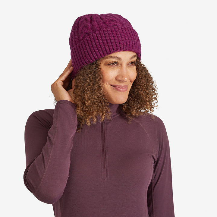 Woman wearing a Tayberry Red Genus Cable Knit Merino Wool Hat 