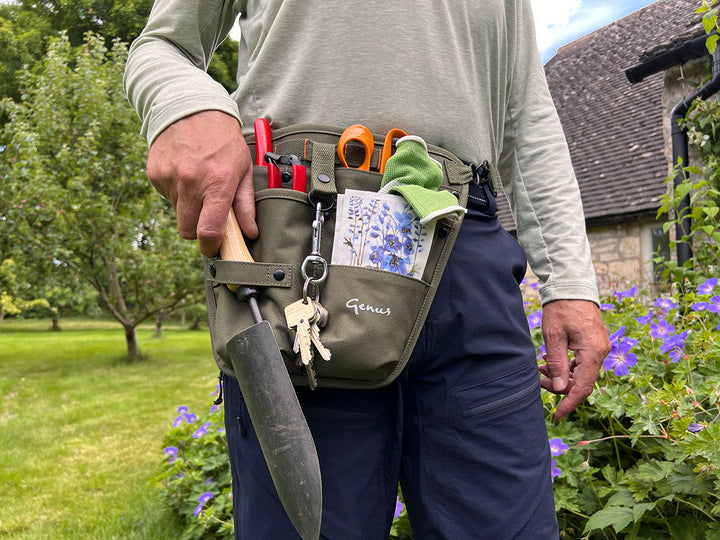Man wearing the Genus Gardening Tool Holster in a garden
