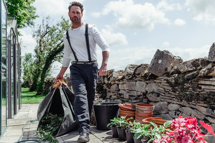 Man in his garden wearing the Genus Gardening Braces