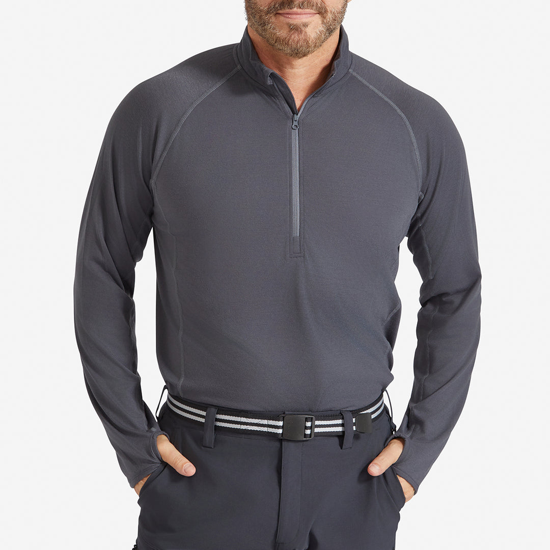 Man wearing a Genus Men's Charcoal Eden Zip-Neck Top tucked in