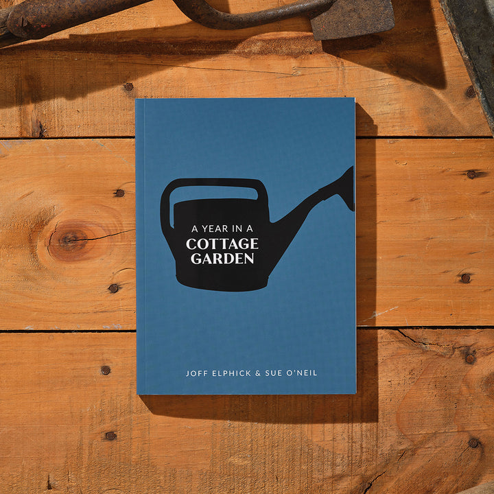 Genus A Year In A Cottage Garden Book on a table