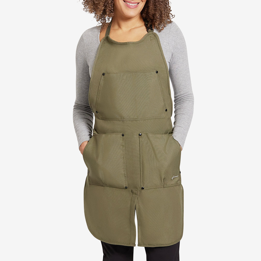 Woman wearing a Genus gardening apron