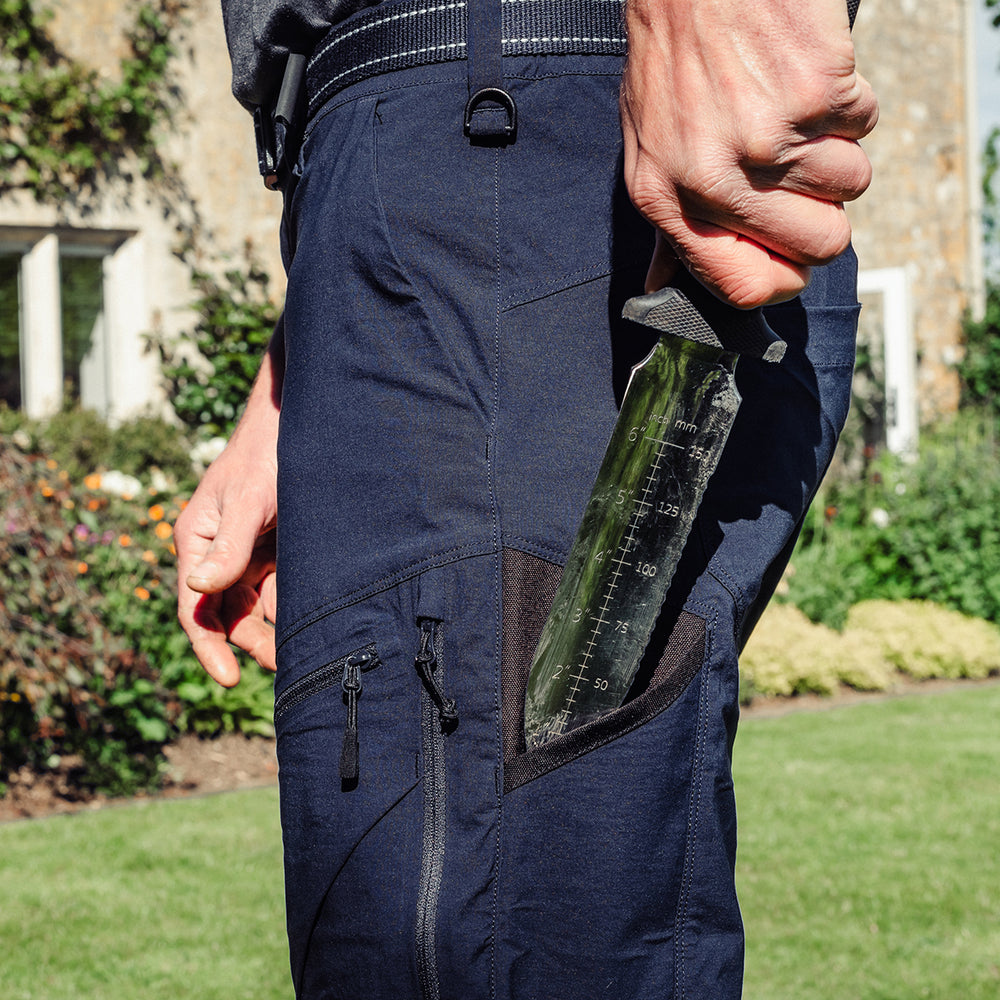 Man wearing the Genus Men's Summer Gardening Trousers Dark Navy in his garden