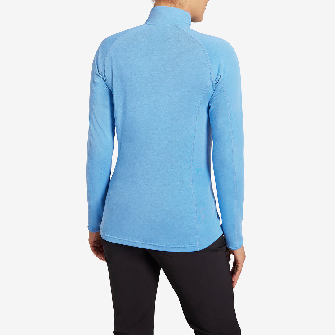 Back view of the Genus Women's Parisian Blue Eden Zip Neck Top