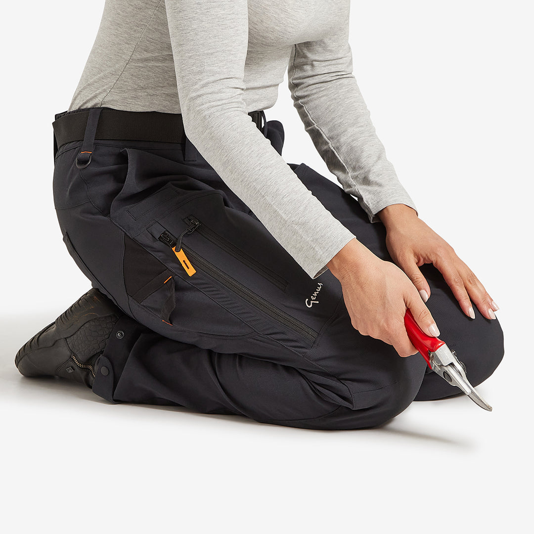 Woman on her knees in the Genus Women's Gardening Propants