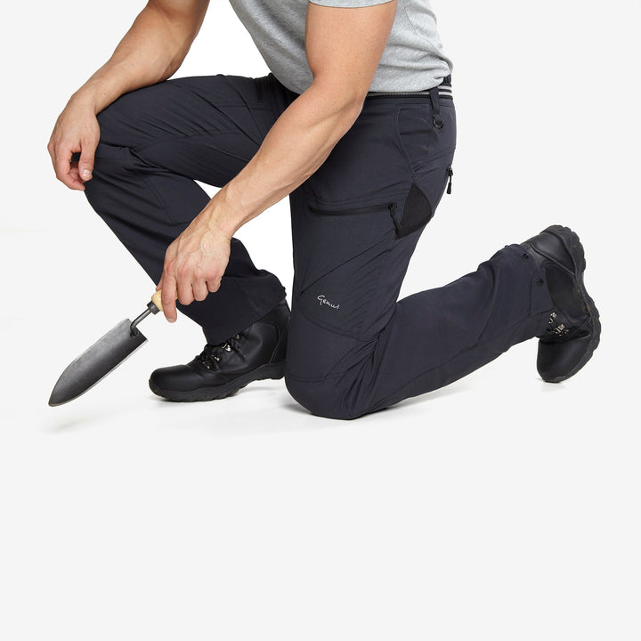 Man kneeling down wearing a pair of Genus Men's 3 Season Gardening Trousers Midnight
